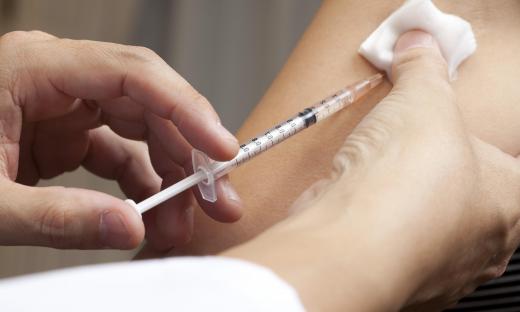 A physician who volunteers with Doctors Without Borders may provide vaccinations in poor nations.