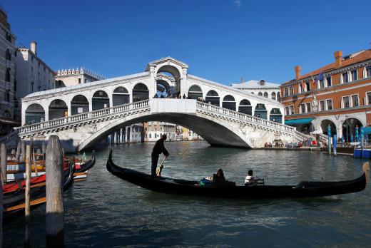 Gondolas are the most well-recognized boat used in the canals of Venice.