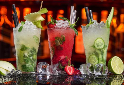 A tiki bar specializes in making complicated fruit cocktails.