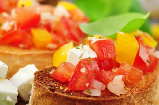 Tomato and pepper bruschetta appetizers for a casino-themed party.