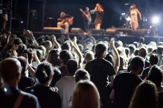 Crowd surfing is a common occurrence at rock concerts.