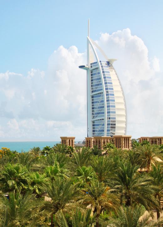 The Burj al Arab is an iconic hotel on the waterfront in Dubai.