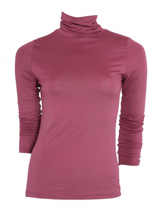 Thin turtleneck shirts should be packed for a ski vacation.